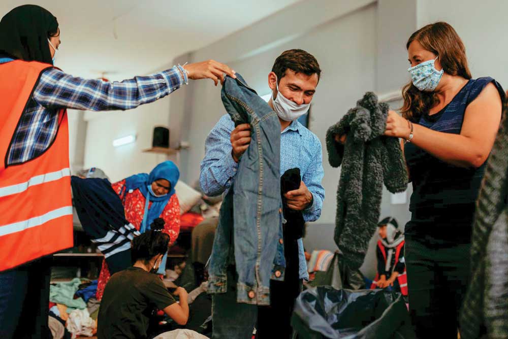 Refugees receiving clothing